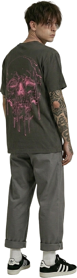 Man wearing a black t-shirt with a pink skull graphic design on the back, standing looking back..
